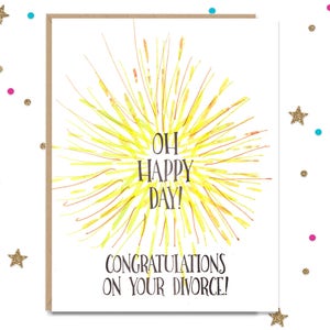 May include: A white card with a yellow sunburst design and the text "Oh Happy Day! Congratulations on your divorce!"