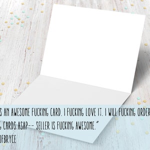 May include: A white card with a folded edge, sitting on a light wood surface with scattered yellow and blue confetti. The card has a handwritten message that reads "THIS IS AN AWESOME FUCKING CARD. I FUCKING LOVE IT. I WILL FUCKING ORDER MORE FUCKING CARDS ASAP-- SELLER IS FUCKING AWESOME." The message is signed "MOMOFBRYCE".