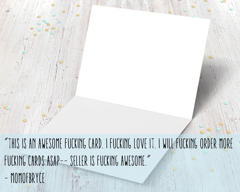 May include: A white card with a folded edge, sitting on a light wood surface with scattered yellow and blue confetti. The card has a handwritten message that reads "THIS IS AN AWESOME FUCKING CARD. I FUCKING LOVE IT. I WILL FUCKING ORDER MORE FUCKING CARDS ASAP-- SELLER IS FUCKING AWESOME." The message is signed "MOMOFBRYCE".