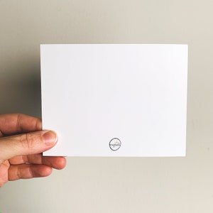 May include: Blank white card with a small black circle logo that says "my next" in white text.