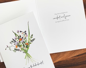 May include: White sympathy card with a watercolor floral bouquet in shades of purple, orange, and green. The card reads "The Lord is near the brokenhearted" on the front and "May the Lord give you comfort and peace during this difficult loss" inside.