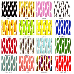 May include: A collection of 16 different coloured and textured tiles, each with a diamond shape. The tiles are arranged in a grid pattern, with each colour and texture represented in a separate square. The colours include black, gold, purple, white, orange, lime green, yellow, deep blue, burgundy red, silver, pale blue, deep green, sage green, pink, iridescent, and bright red.