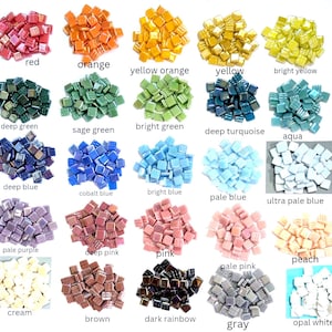 May include: A collection of twenty-five small piles of square glass mosaic tiles arranged in a grid. Each pile features a distinct colour, including red, orange, yellow, green, blue, purple, pink, brown, grey, and white, with labels below each.