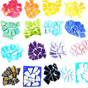 May include: A collection of small, irregular glass mosaic tiles arranged in sixteen distinct color groups. The set includes shades of red, orange, yellow, lime green, teal, blue, purple, lavender, pink, brown, white, and black, featuring glossy finishes.