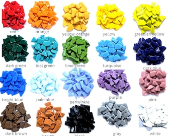 May include: A collection of twenty piles of small, irregularly shaped glass mosaic tiles arranged in a grid. Each pile features a distinct colour, including red, orange, yellow-orange, yellow, greenish yellow, dark green, teal, lime, turquoise, blue, and others.