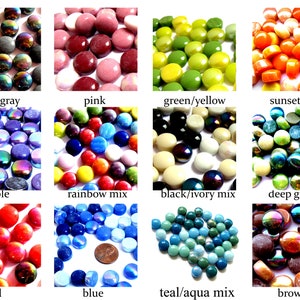 May include: Assortment of glass mosaic tiles in various colors, including black, gray, pink, green, yellow, purple, rainbow mix, ivory, deep green, red, blue, teal, and brown.