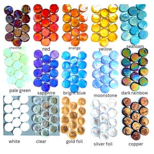 May include: A collection of round glass cabochons arranged in fifteen color-coded groups, including chestnut, red, orange, yellow, seafoam, pale green, sapphire, bright blue, moonstone, dark rainbow, white, clear, gold foil, silver foil, and copper.