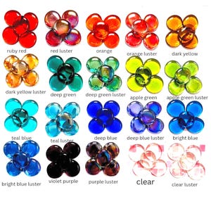 May include: A collection of twenty flower-shaped arrangements made of five circular glass cabochons each, displayed in various colors including ruby red, orange, deep green, apple green, teal, blue, violet, and clear, with labeled text.