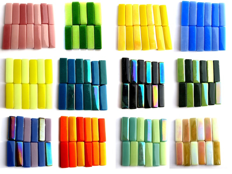 May include: Assortment of 12 glass tiles in various colors, including pink, green, yellow, blue, teal, black, orange, and beige. Each tile is rectangular and has a smooth, glossy finish.