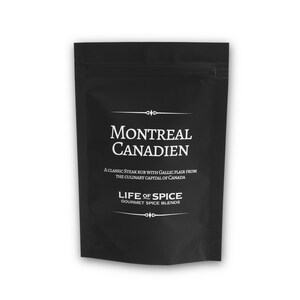 May include: A black pouch with white text that reads "Montreal Canadien" and "A classic steak rub with Gallic flair from the culinary capital of Canada." Below the text is the logo "Life of Spice Gourmet Spice Blends."