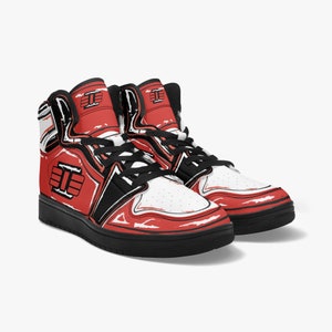 May include: A pair of red, white, and black high-top sneakers with a black and white graphic design on the side. The sneakers have a black sole and a white midsole.