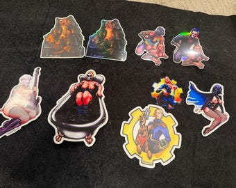 May include: A collection of nine die-cut stickers featuring various illustrated characters, including figures in a bathtub, a person with a guitar, a character in a blue jumpsuit with a dog, and other stylized individuals with colorful and holographic details.