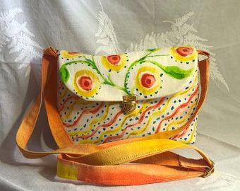 Graphic flower bouquet, custom-made and hand-painted with oranges, yellows, blue, and green. Summer fun cross-body bag.