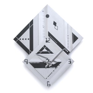 May include: Geometric wall clock with a white background. The clock features a square design with black geometric patterns and the numbers 3, 6, 9, and 12. The clock hands are black and point to the time. The clock is made of paper.