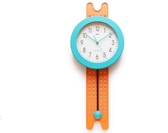 NOS Postmodern Pendulum Clock - Turquoise Wall Memphis Style Plastic 1980s 1990s quartz New In Box