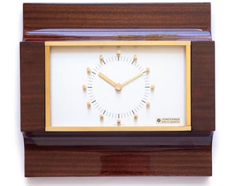 Superbe horloge murale JUNGHANS, style moderniste du milieu du siècle, inspiration spatiale allemande, finition noyer et or atomique.