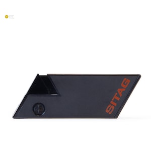 May include: A black rectangular Sitag key fob with a red logo.