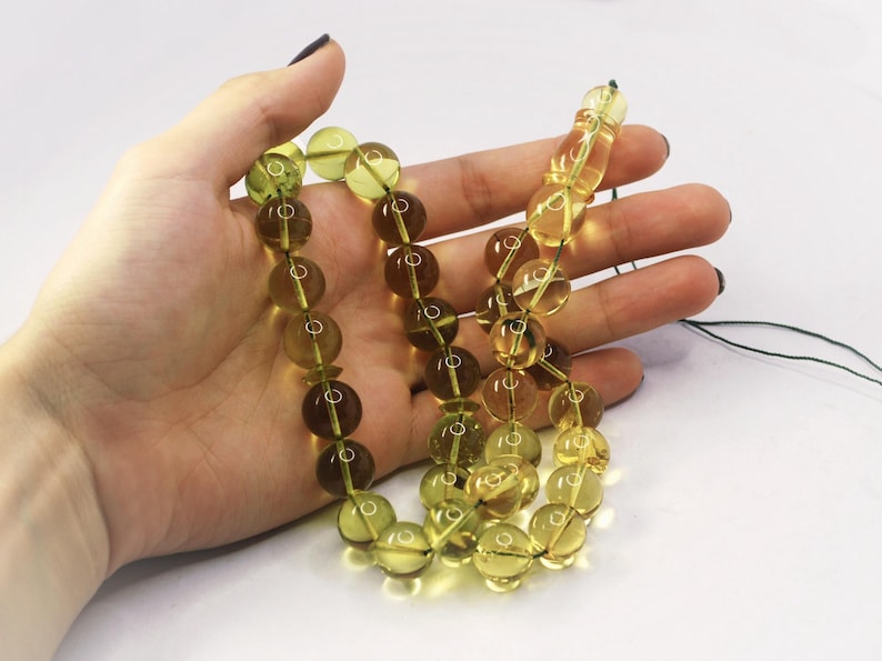 Massive Islam prayer beads Misbaha Tesbih made of genuine green color Caribbean amber. 

Not pressed, not glued, genuine amber

Intense Green color

 33   13 mm diameter ideal round amber beads, 2 separators
