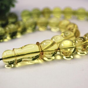 Massive Islam prayer beads Misbaha Tesbih made of genuine green color Caribbean amber. 

Not pressed, not glued, genuine amber

Intense Green color

 33   13 mm diameter ideal round amber beads, 2 separators