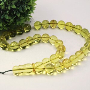 Massive Islam prayer beads Misbaha Tesbih made of genuine green color Caribbean amber. 

Not pressed, not glued, genuine amber

Intense Green color

 33   13 mm diameter ideal round amber beads, 2 separators