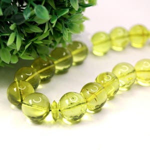 Massive Islam prayer beads Misbaha Tesbih made of genuine green color Caribbean amber. 

Not pressed, not glued, genuine amber

Intense Green color

 33   13 mm diameter ideal round amber beads, 2 separators