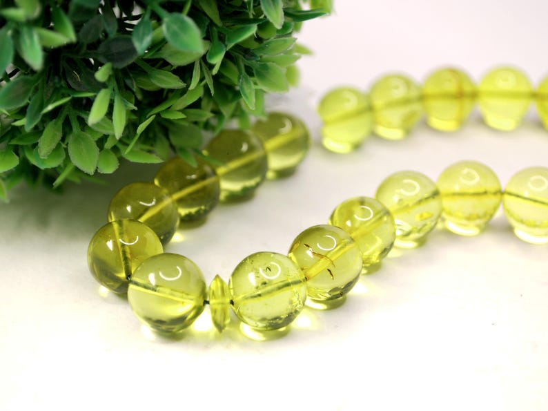 Massive Islam prayer beads Misbaha Tesbih made of genuine green color Caribbean amber. 

Not pressed, not glued, genuine amber

Intense Green color

 33   13 mm diameter ideal round amber beads, 2 separators