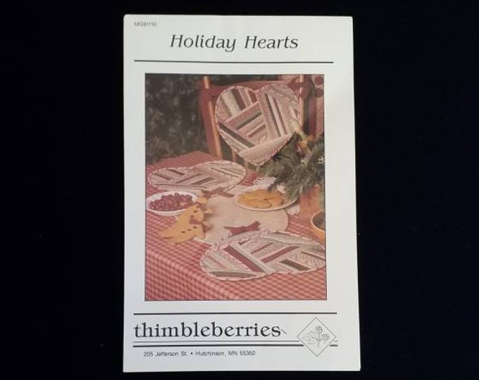 Holiday Hearts quilted chair cushion and table runner sewing pattern from Thimbleberries.