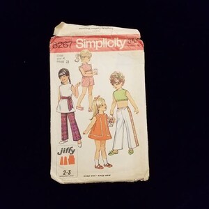 Vintage Simplicity girls dress, pants, and top sewing pattern child size 4