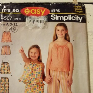 May include: A sewing pattern for children's clothing. The pattern includes instructions for making a sleeveless top and shorts. The pattern is for sizes 3-12. The pattern is from Simplicity and is labeled "It's so easy".