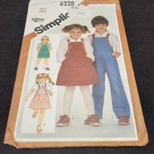 May include: A sewing pattern for children's overalls. The pattern is for size 4 and includes instructions for making both a skirt and pants style. The pattern is from the company Simplic and has the number 6228 on it.