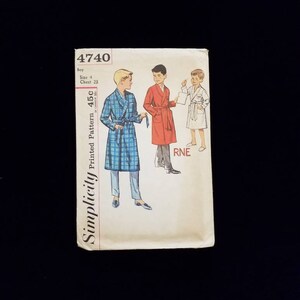 May include: Simplicity sewing pattern number 4740 for a boy's robe. The pattern includes three sizes: 4, 6, and 8. The pattern is for a printed pattern and is in inches.
