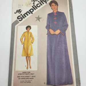 May include: Vintage Simplicity sewing pattern, size 10 Miss. The pattern features illustrations of a long, purple robe with red trim and a yellow coat. The pattern is sized for stretch knits only. The pattern number is 9782.