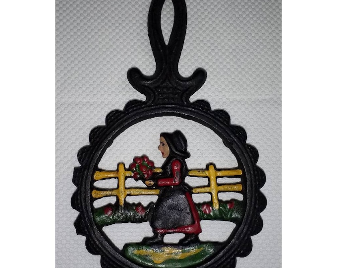 Vintage retro stlye small iron trivet with lady walking with flowers  Free Shipping