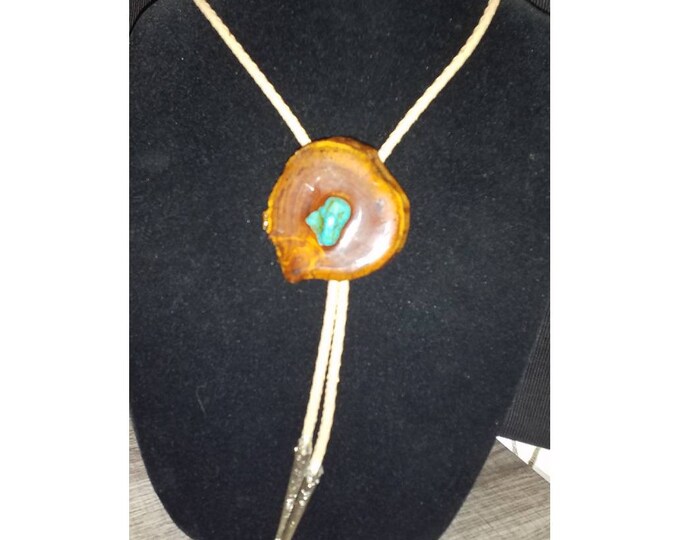 Vintage western bolo tie made with wood and turqouise stone, leather.