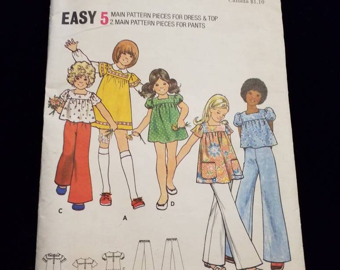 Vintage Butterick 3077.  Children's size 8 dress, pants, tunic,and shirt sewing pattern.  New