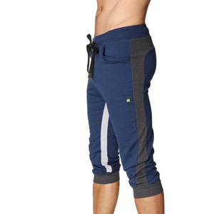 May include: Blue, gray, and white athletic pants with a drawstring waist and side pockets.