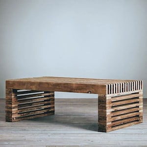 May include: A wooden coffee table with a rectangular top and a slatted design on the sides. The table is made of natural wood and has a rustic look.
