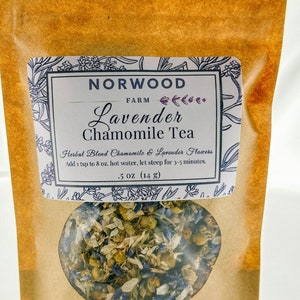 May include: A brown paper pouch with a white label that reads "NORWOOD FARM Lavender Chamomile Tea" and "Herbal Blend Chamomile & Lavender Flowers". The label also includes instructions for brewing the tea: "Add 1 tsp to 8 oz. hot water, let steep for 3-5 minutes." The pouch contains a blend of dried chamomile and lavender flowers.