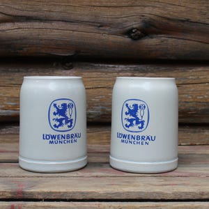 Vintage Pair of Lowenbrau Munchen Stoneware Heavy Beer Mug Steins