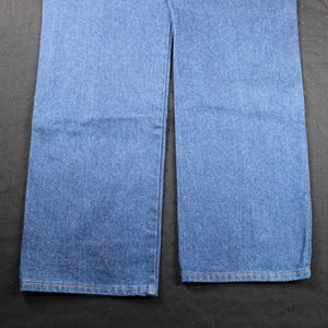 May include: A pair of blue denim jeans with a straight leg fit.