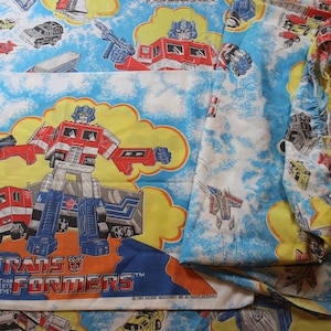 Zestaw łóżek dla dwóch osób w stylu Transformers 1984 z dopasowaną poszewką na poduszkę, prześcieradłami płaskimi i dopasowanymi
