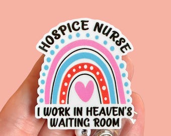 May include: A white badge holder with a rainbow design and the text "Hospice Nurse I work in Heaven's Waiting Room".