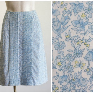 A-line skirt with blue and yellow flower and butterfly print and pintucked front