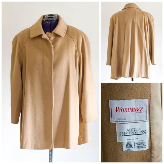 Camel color wool swing coat with large shoulder pa