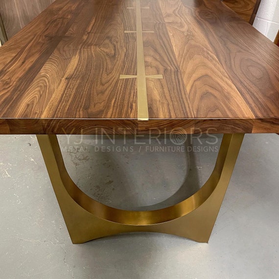 Walnut and 2024 brass dining table