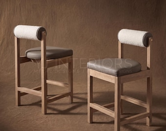 May include: Two bar stools with light wood frames, grey upholstered seats, and cylindrical white textured backrests. The text YJ INTERIORS METAL DESIGNS / FURNITURE DESIGNS is visible in the center. Each stool features four legs and a footrest.