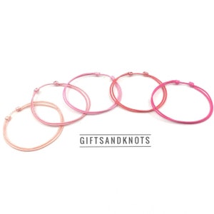 Verstelbare roze armbanden 1 mm dunne schoolbedankjes