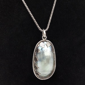 Oval Mother of Pearl Pendant with Silver Art Deco Border Motif and Sterling Silver Chain