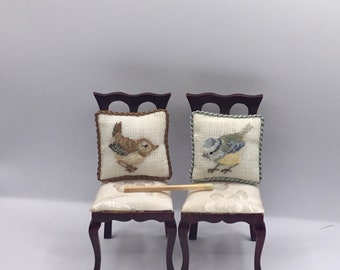 Miniature cushion for dollhouse, with small point embroidered bird on linen canvas.