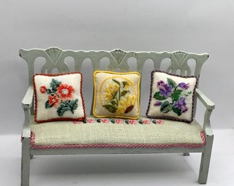 Miniature cushion for dollhouse, with small point flower embroidery on linen canvas.